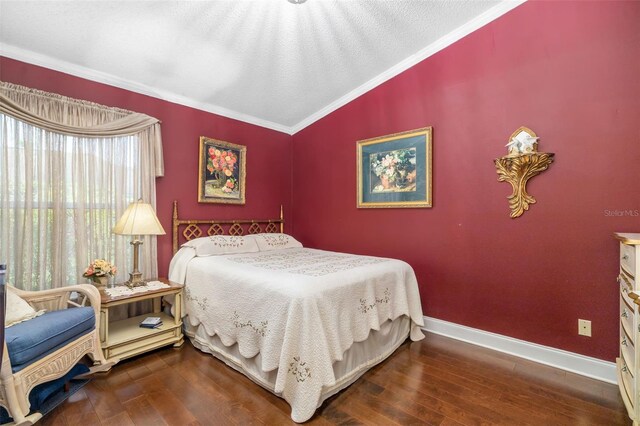 2411 New Haven Cir Unit 70, Sun City Center, FL 33573 - bedroom featuring ornamental molding, hardwood / wood-style flooring, and vaulted ceiling