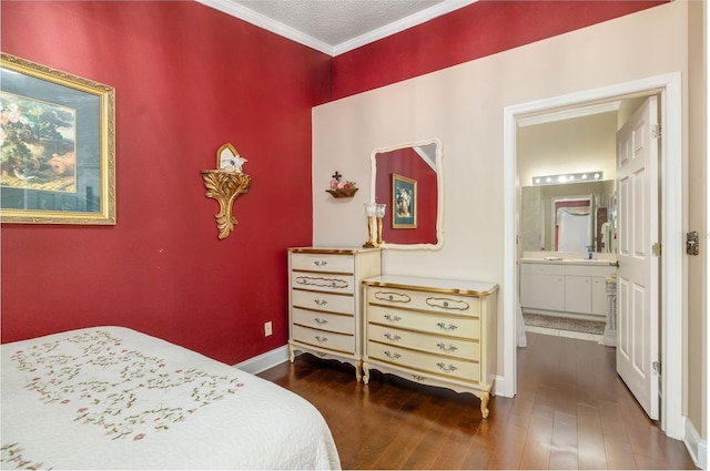 2411 New Haven Cir Unit 70, Sun City Center, FL 33573 - bedroom with wood-type flooring, crown molding, and connected bathroom