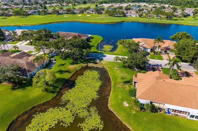 2411 New Haven Cir Unit 70, Sun City Center, FL 33573 - aerial view of residential area featuring a large body of water and a local golf course