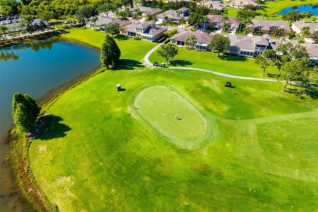 2411 New Haven Cir Unit 70, Sun City Center, FL 33573 - aerial perspective of suburban area featuring a large body of water and a golf club