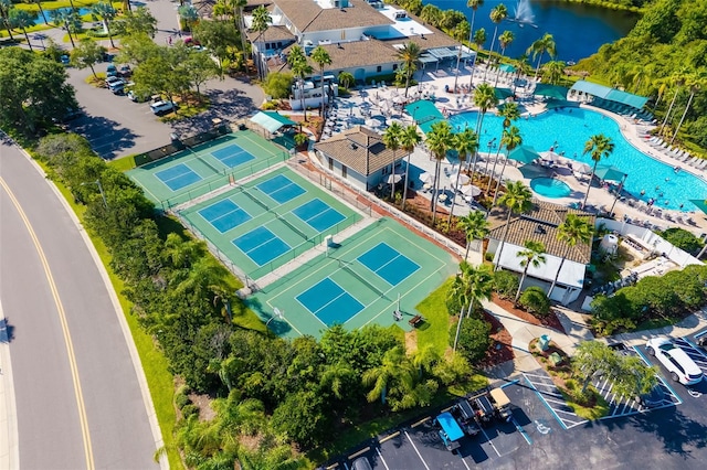 2411 New Haven Cir Unit 70, Sun City Center, FL 33573 - drone / aerial view of a pool and a nearby body of water