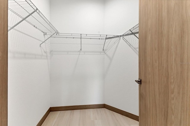 299 Australian Dr, Rotonda West, FL 33947 - walk in closet featuring light wood-style floors