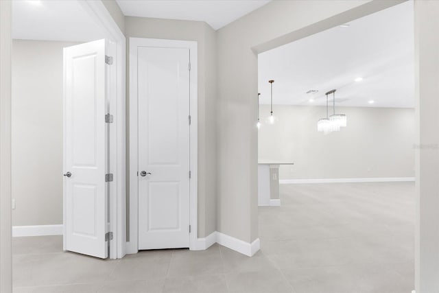 7661 Summerland Cv, Bradenton, FL 34202 - hallway with light tile patterned flooring and recessed lighting