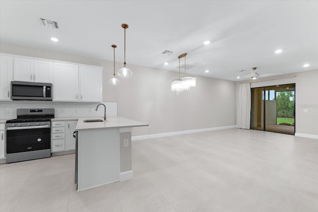 7661 Summerland Cv, Bradenton, FL 34202 - kitchen featuring stainless steel appliances, light countertops, backsplash, a peninsula, and recessed lighting