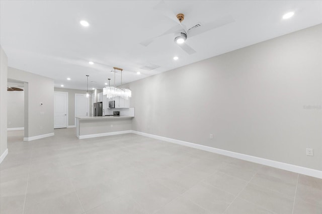 7661 Summerland Cv, Bradenton, FL 34202 - unfurnished living room featuring ceiling fan and recessed lighting