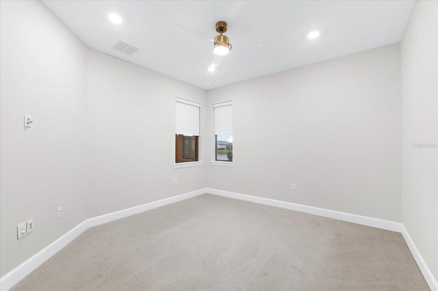 7661 Summerland Cv, Bradenton, FL 34202 - empty room featuring light carpet and recessed lighting
