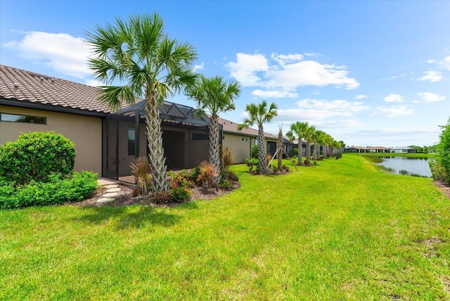 7661 Summerland Cv, Bradenton, FL 34202 - view of grassy yard with a water view and glass enclosure