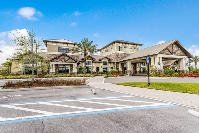 7661 Summerland Cv, Bradenton, FL 34202 - view of building exterior with uncovered parking