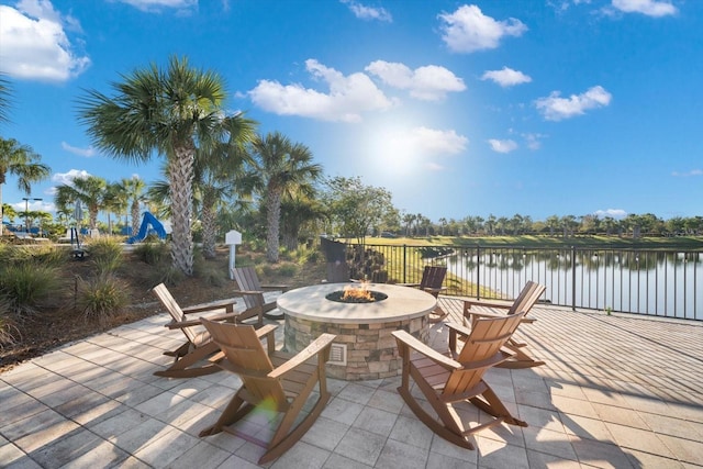 7661 Summerland Cv, Bradenton, FL 34202 - view of patio / terrace with a fire pit and a water view