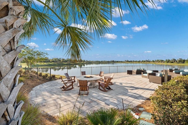 7661 Summerland Cv, Bradenton, FL 34202 - view of patio featuring an outdoor living space with a fire pit and a water view