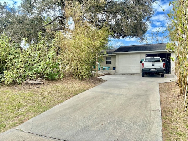 3767 Pinstar Ter, North Port, FL 34287 - view of front of property featuring stucco siding, concrete driveway, and an attached garage