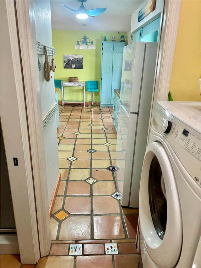 3767 Pinstar Ter, North Port, FL 34287 - laundry area featuring washer / clothes dryer and light tile patterned flooring
