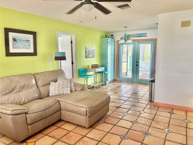 3767 Pinstar Ter, North Port, FL 34287 - living area featuring ceiling fan, french doors, and a textured ceiling