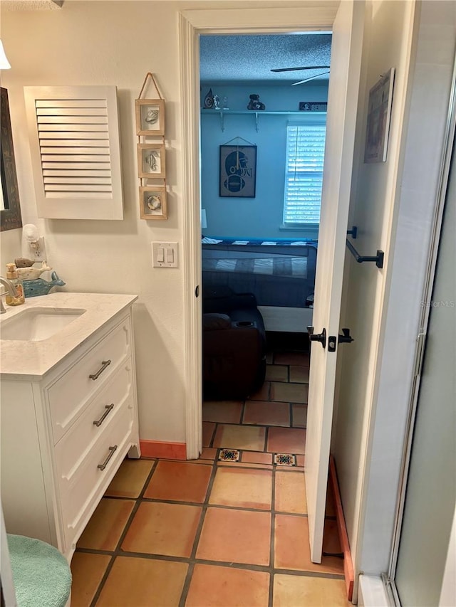 3767 Pinstar Ter, North Port, FL 34287 - ensuite bathroom with vanity and tile patterned flooring