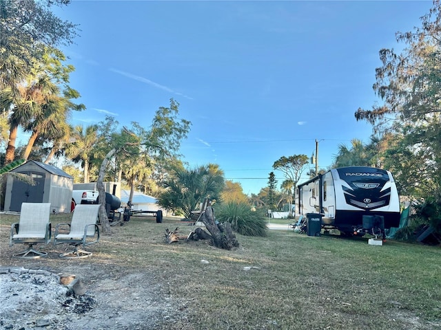 3767 Pinstar Ter, North Port, FL 34287 - view of grassy yard featuring a storage shed
