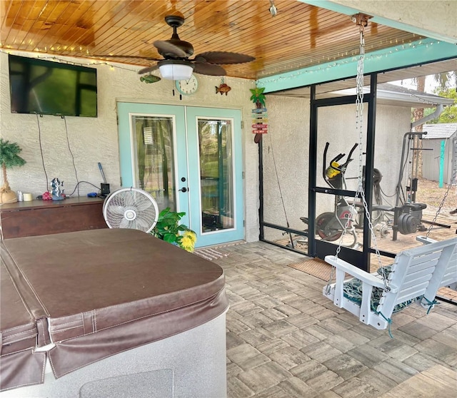 3767 Pinstar Ter, North Port, FL 34287 - sunroom / solarium with french doors, a ceiling fan, and a hot tub