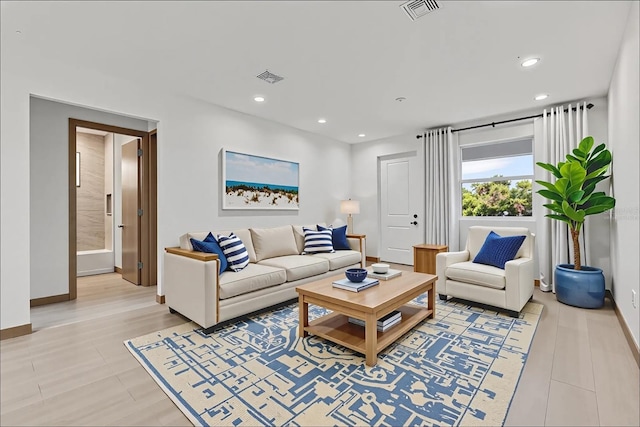 102 Arrow Ln, Rotonda West, FL 33947 - living room featuring baseboards and recessed lighting