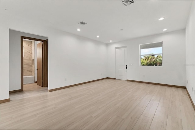 102 Arrow Ln, Rotonda West, FL 33947 - spare room with recessed lighting and light wood-style flooring