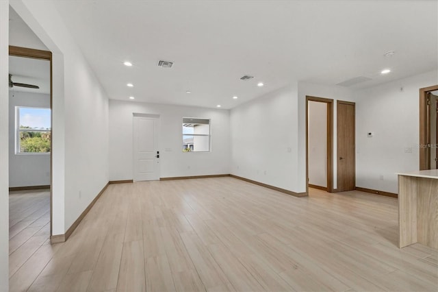 102 Arrow Ln, Rotonda West, FL 33947 - spare room with light wood-style flooring and recessed lighting