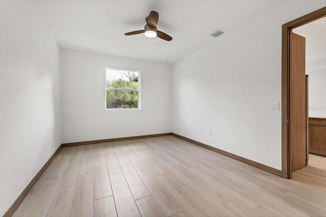 102 Arrow Ln, Rotonda West, FL 33947 - empty room with a ceiling fan and light wood-type flooring