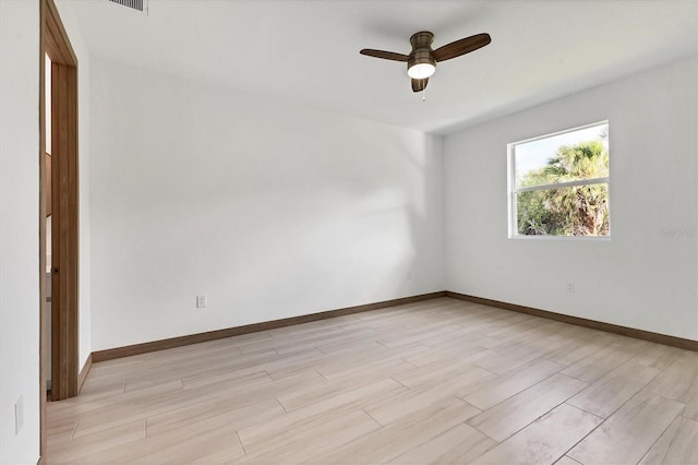 102 Arrow Ln, Rotonda West, FL 33947 - spare room with light wood finished floors and ceiling fan