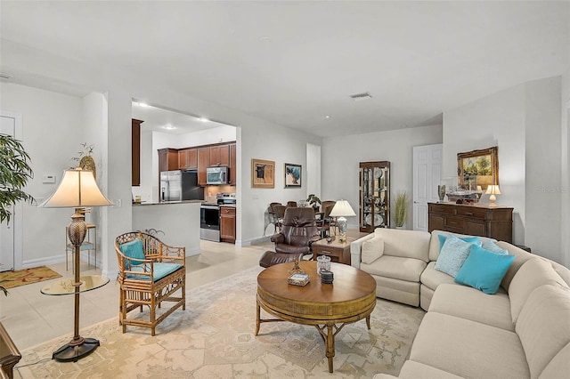 5662 Fossano Dr, Sarasota, FL 34238 - living area featuring recessed lighting and light tile patterned floors