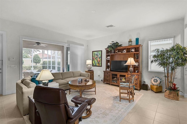 5662 Fossano Dr, Sarasota, FL 34238 - living area featuring light tile patterned floors and ceiling fan