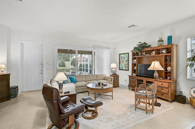 5662 Fossano Dr, Sarasota, FL 34238 - living area with light tile patterned floors and healthy amount of natural light