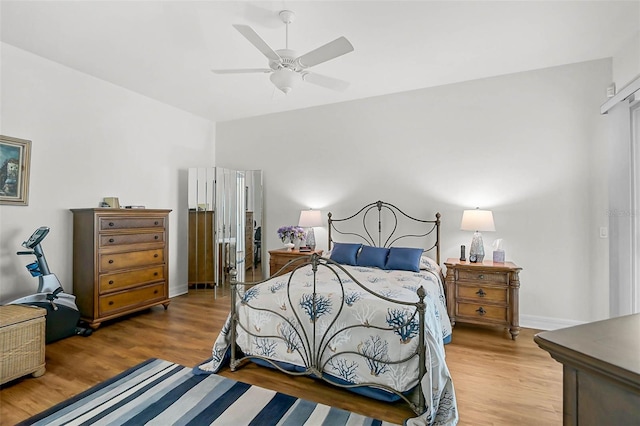 5662 Fossano Dr, Sarasota, FL 34238 - bedroom with wood finished floors and a ceiling fan