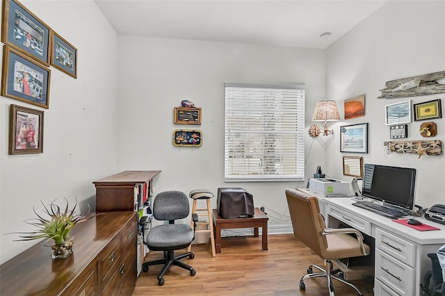 5662 Fossano Dr, Sarasota, FL 34238 - office area featuring light wood-style flooring and baseboards