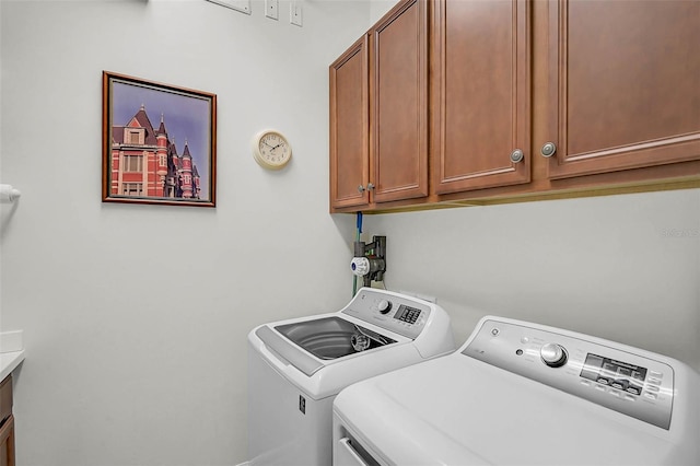 5662 Fossano Dr, Sarasota, FL 34238 - washroom with separate washer and dryer and cabinet space