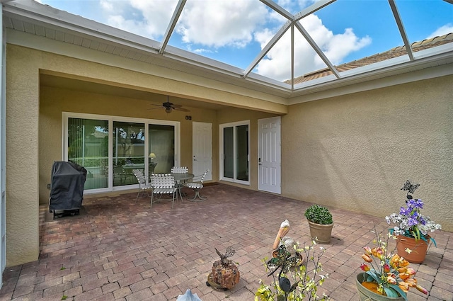 5662 Fossano Dr, Sarasota, FL 34238 - view of patio / terrace featuring a ceiling fan, a grill, and a lanai