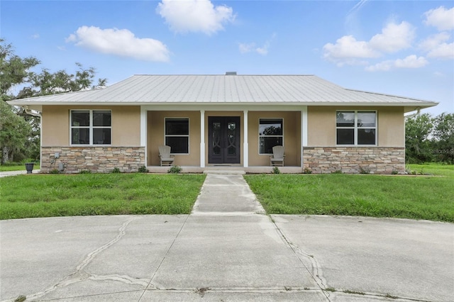 920 Lena Ln, Sarasota, FL 34240 - view of front of home with stone siding, stucco siding, and covered porch