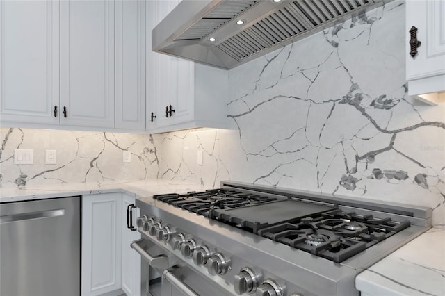 920 Lena Ln, Sarasota, FL 34240 - kitchen with appliances with stainless steel finishes, custom range hood, backsplash, white cabinetry, and light stone countertops