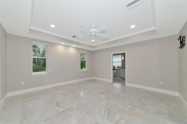 920 Lena Ln, Sarasota, FL 34240 - unfurnished room featuring a tray ceiling, a ceiling fan, ornamental molding, recessed lighting, and light marble finish floors