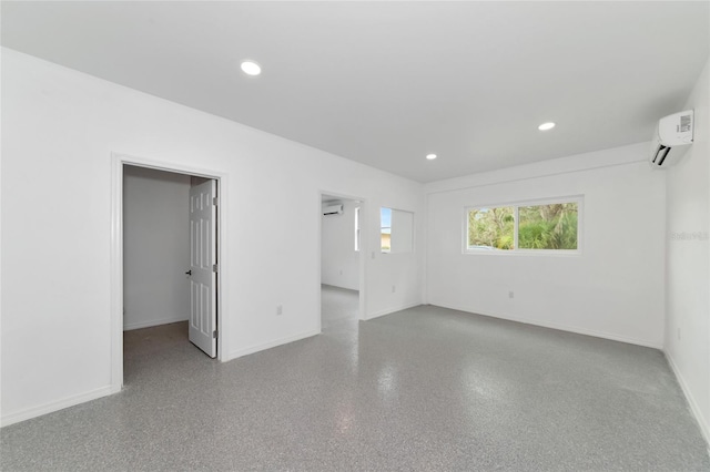 920 Lena Ln, Sarasota, FL 34240 - spare room with a wall mounted AC, a wall mounted air conditioner, and recessed lighting