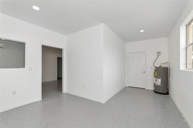 920 Lena Ln, Sarasota, FL 34240 - spare room with electric water heater and recessed lighting
