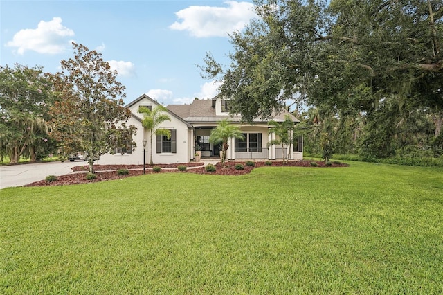 3906 Twin Rivers Trl, Parrish, FL 34219 - view of front facade with a front yard, stucco siding, and concrete driveway