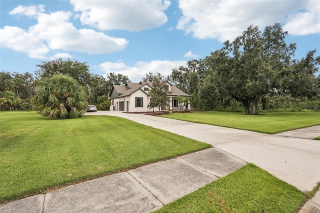 3906 Twin Rivers Trl, Parrish, FL 34219 - modern farmhouse with a front lawn and concrete driveway