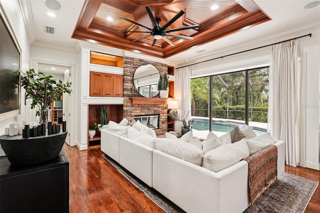 3906 Twin Rivers Trl, Parrish, FL 34219 - living area with a ceiling fan, a tray ceiling, dark wood-type flooring, ornamental molding, and coffered ceiling