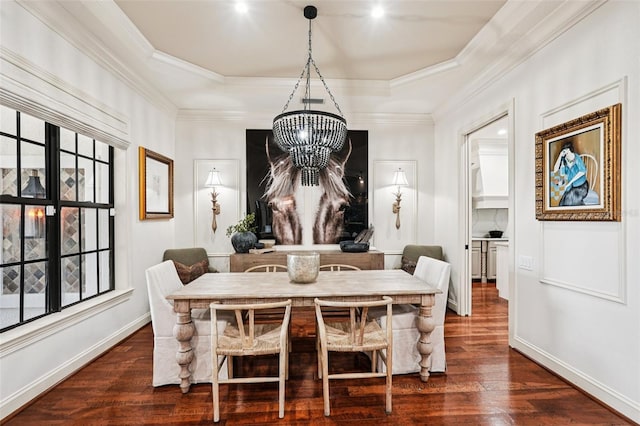 3906 Twin Rivers Trl, Parrish, FL 34219 - dining room featuring dark wood-type flooring, plenty of natural light, a chandelier, and crown molding