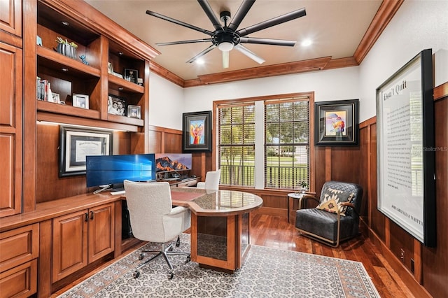 3906 Twin Rivers Trl, Parrish, FL 34219 - home office with dark wood finished floors, ornamental molding, a wainscoted wall, built in desk, and wood walls