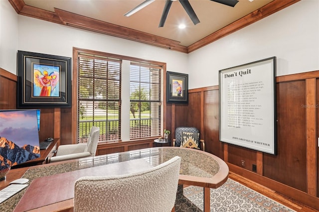 3906 Twin Rivers Trl, Parrish, FL 34219 - sitting room with crown molding, a ceiling fan, wood finished floors, wooden walls, and wainscoting
