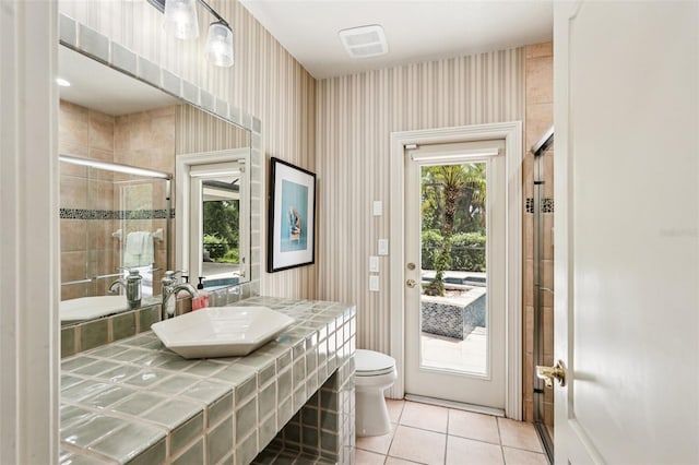 3906 Twin Rivers Trl, Parrish, FL 34219 - full bath featuring a shower stall, tile patterned flooring, vanity, and wallpapered walls