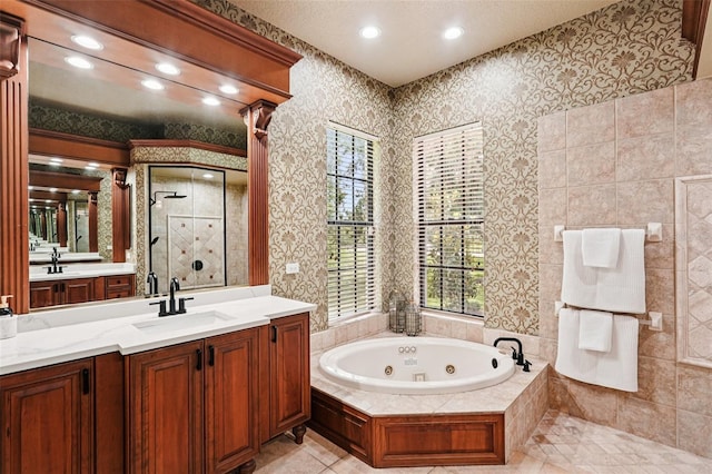 3906 Twin Rivers Trl, Parrish, FL 34219 - full bath featuring a shower stall, a jetted tub, vanity, healthy amount of natural light, and recessed lighting