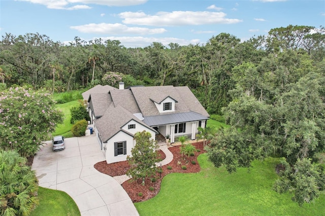 3906 Twin Rivers Trl, Parrish, FL 34219 - view of front of property featuring driveway, a forest view, and a front yard
