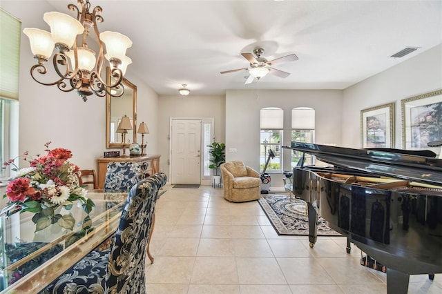 1415 Millbrook Cir, Bradenton, FL 34212 - living area with light tile patterned floors, a chandelier, ceiling fan, and arched walkways