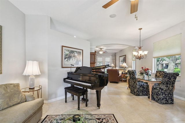 1415 Millbrook Cir, Bradenton, FL 34212 - living area with a ceiling fan, arched walkways, a chandelier, and light tile patterned floors