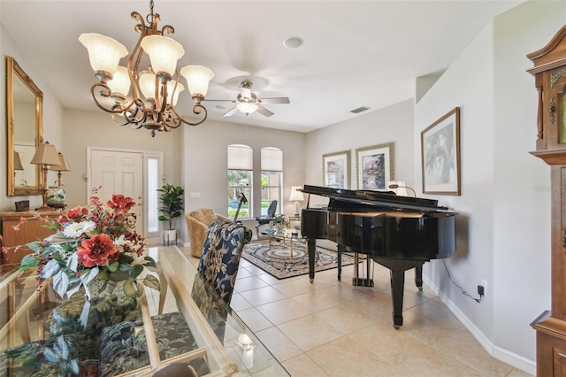 1415 Millbrook Cir, Bradenton, FL 34212 - dining area with light tile patterned floors, ceiling fan, and a chandelier