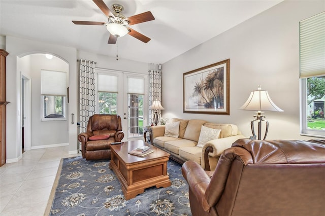 1415 Millbrook Cir, Bradenton, FL 34212 - living area featuring ceiling fan, light tile patterned flooring, arched walkways, and french doors